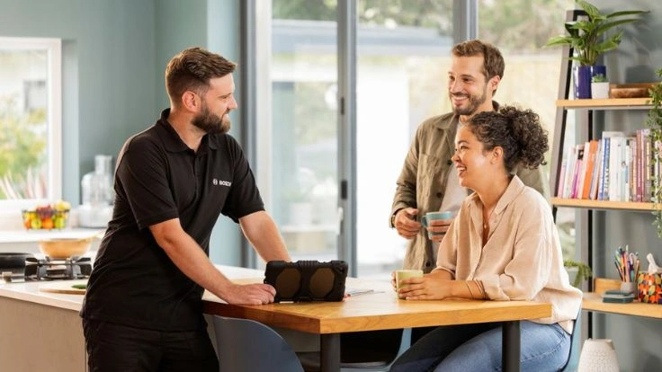 installer talking to homeowners